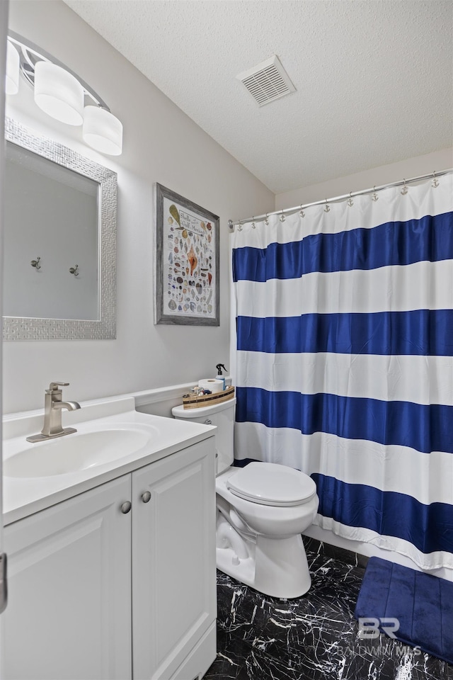bathroom with toilet, marble finish floor, vanity, a textured ceiling, and visible vents
