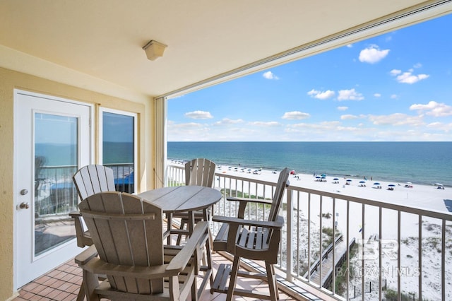 balcony with a view of the beach and a water view