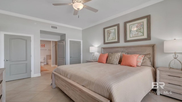 tiled bedroom with ornamental molding, ensuite bathroom, and ceiling fan