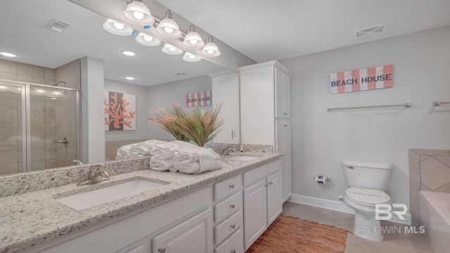 bathroom featuring dual sinks, tile flooring, oversized vanity, a washtub, and toilet