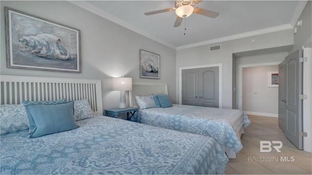 tiled bedroom featuring ceiling fan, ornamental molding, and a closet