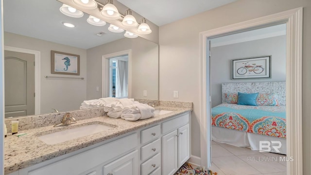 bathroom featuring vanity with extensive cabinet space, tile flooring, and dual sinks