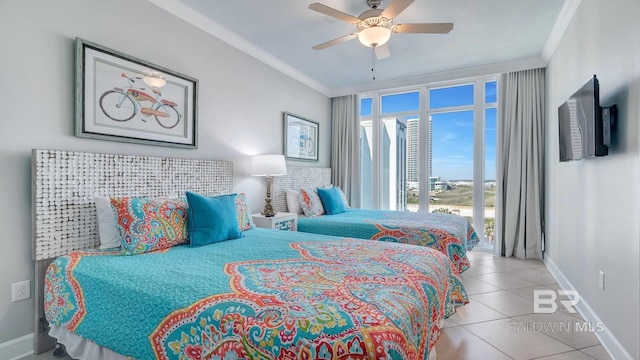 tiled bedroom featuring ornamental molding and ceiling fan