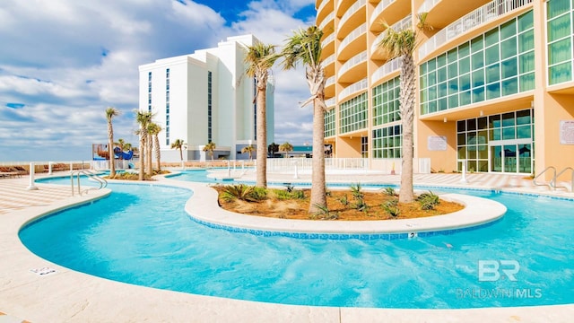 view of swimming pool featuring a patio area