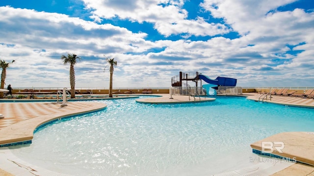 view of pool with a water slide