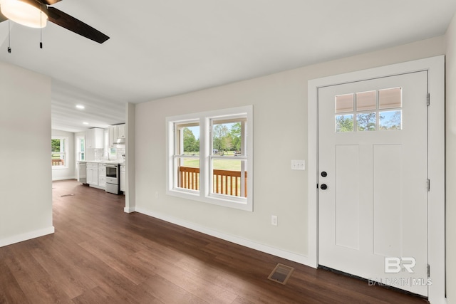 entrance foyer with dark wood finished floors, baseboards, visible vents, ceiling fan, and recessed lighting