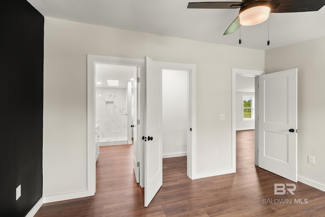 unfurnished bedroom with baseboards, ceiling fan, and wood finished floors