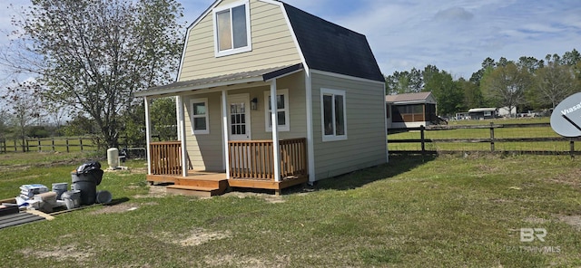 view of outbuilding with fence