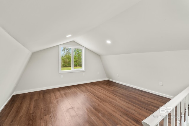 bonus room with baseboards, vaulted ceiling, recessed lighting, and dark wood-style flooring