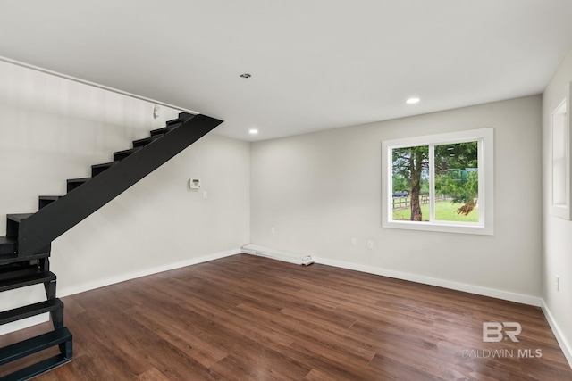 interior space with recessed lighting, baseboards, stairs, and wood finished floors