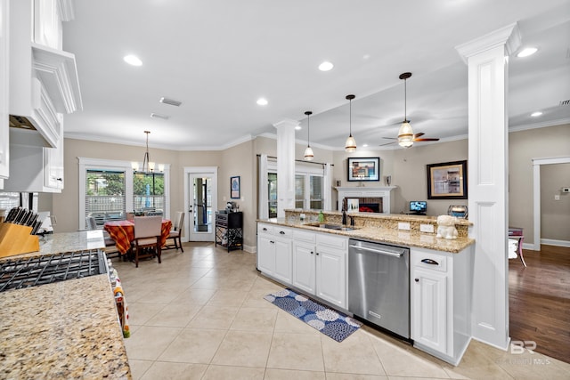 kitchen with ceiling fan, sink, light stone counters, stainless steel dishwasher, and white cabinets