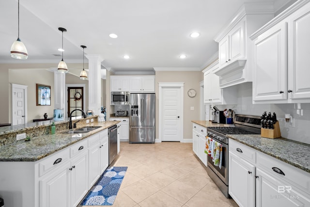 kitchen with decorative backsplash, white cabinetry, stainless steel appliances, and decorative light fixtures