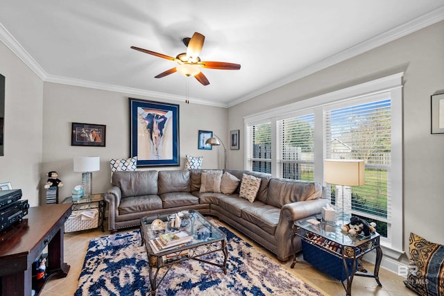 living room featuring ceiling fan, light tile patterned floors, and crown molding