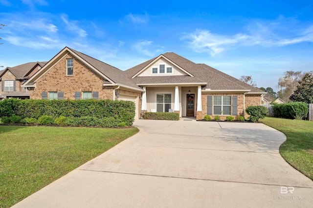 view of front of property featuring a garage and a front yard