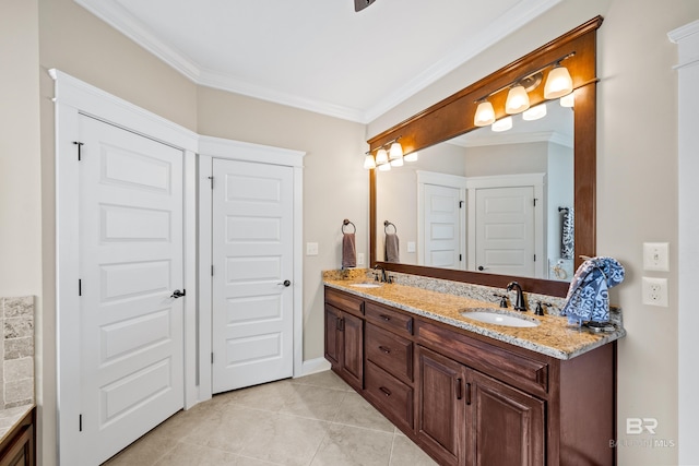 bathroom with tile patterned floors, crown molding, and vanity