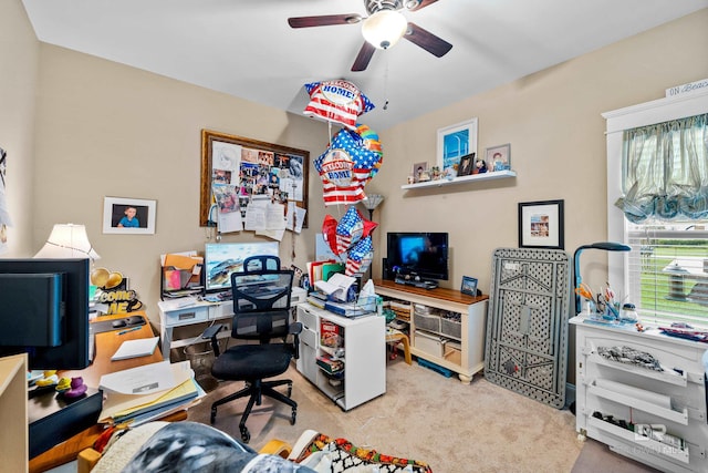 office area with ceiling fan and light colored carpet