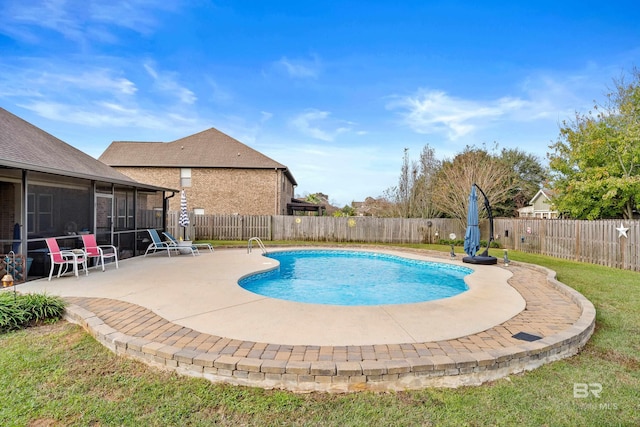 view of swimming pool featuring a patio and a sunroom