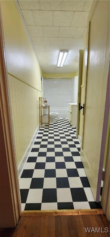 corridor featuring crown molding