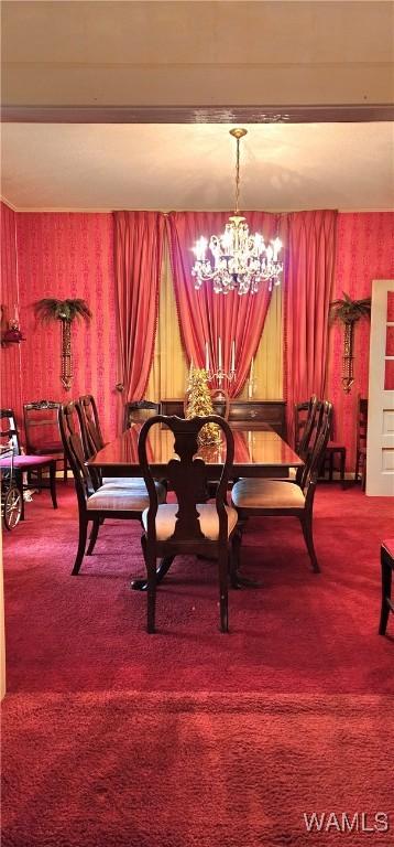 carpeted dining space featuring a chandelier