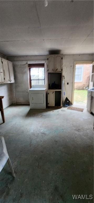 interior space featuring washer / clothes dryer and a wealth of natural light