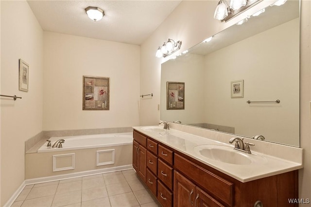17174 Finnell Rd, Northport, AL 35475 - bathroom featuring tile patterned floors, double vanity, a garden tub, and a sink