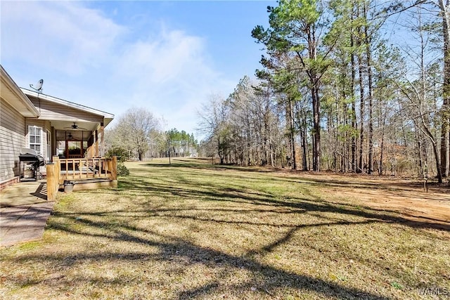 17174 Finnell Rd, Northport, AL 35475 - view of yard with a ceiling fan and a wooden deck