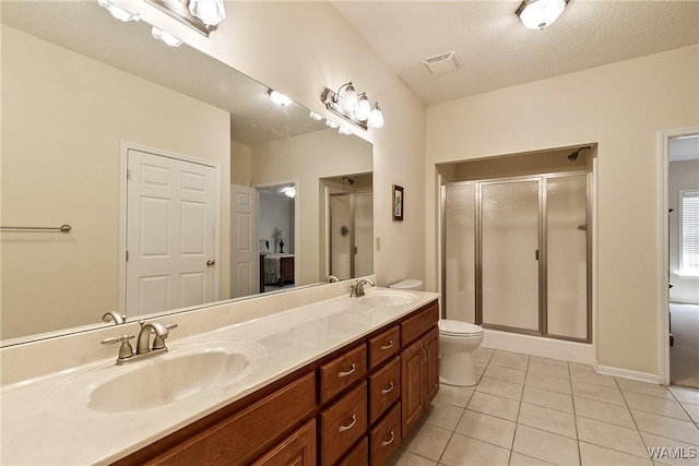 17174 Finnell Rd, Northport, AL 35475 - full bath featuring a sink, double vanity, a shower stall, and tile patterned flooring