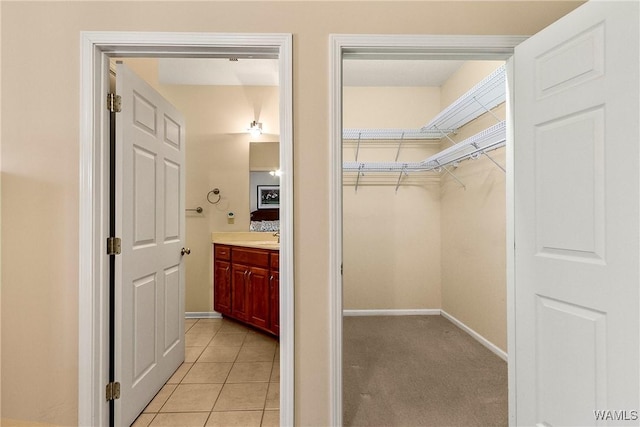 17174 Finnell Rd, Northport, AL 35475 - interior space with light tile patterned floors, light carpet, and a sink