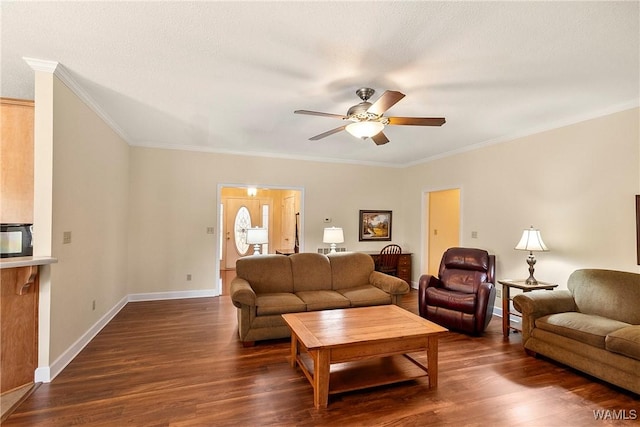 17174 Finnell Rd, Northport, AL 35475 - living room featuring baseboards, a ceiling fan, ornamental molding, and dark wood-style flooring