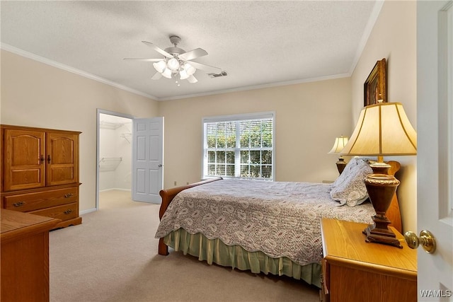17174 Finnell Rd, Northport, AL 35475 - bedroom with visible vents, ceiling fan, a textured ceiling, crown molding, and light carpet