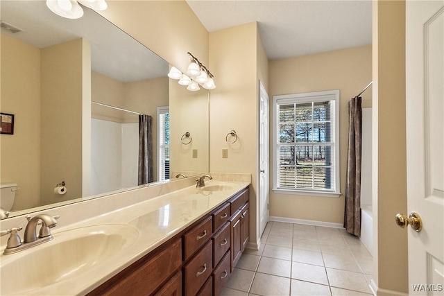 17174 Finnell Rd, Northport, AL 35475 - full bath with tile patterned floors, toilet, visible vents, and a sink