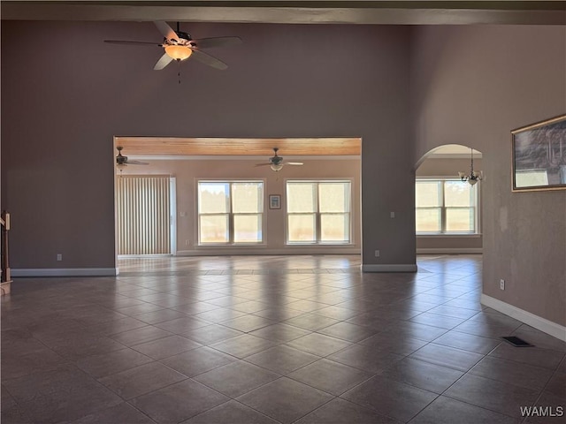 10617 Austin Loop, Vance, AL 35490 - empty room featuring high vaulted ceiling, a ceiling fan, dark tile patterned floors, and arched walkways