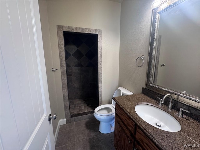 10617 Austin Loop, Vance, AL 35490 - bathroom featuring vanity, a stall shower, tile patterned floors, and a textured wall