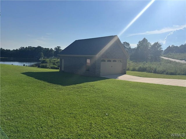 10617 Austin Loop, Vance, AL 35490 - view of home's exterior with a lawn, concrete driveway, and a water view