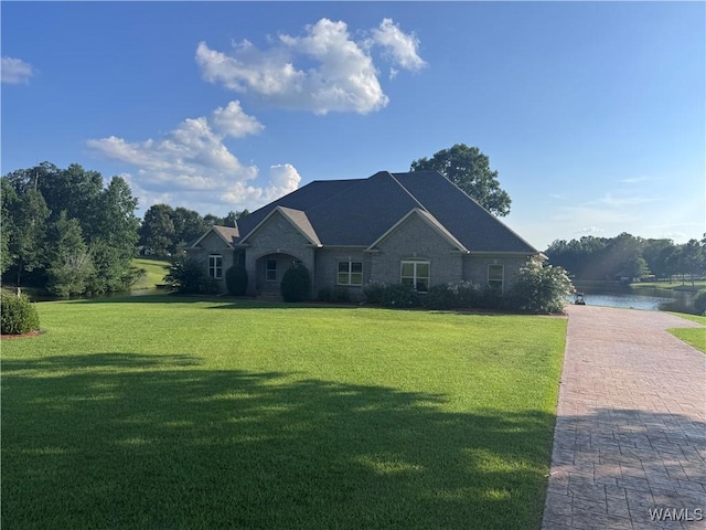 10617 Austin Loop, Vance, AL 35490 - view of front facade with a front yard, a water view, and decorative driveway