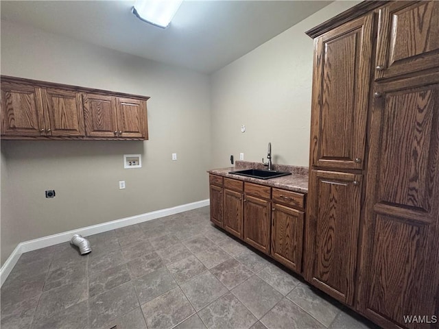 10617 Austin Loop, Vance, AL 35490 - laundry room featuring hookup for an electric dryer, washer hookup, cabinet space, light stone finish flooring, and bar with sink