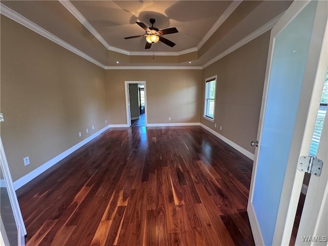 10617 Austin Loop, Vance, AL 35490 - empty room featuring a raised ceiling, dark wood-style flooring, a ceiling fan, and ornamental molding
