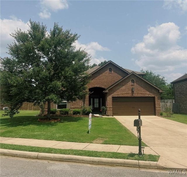 11507 Belle Meade Ave, Northport, AL 35475 - view of front of home featuring driveway, a garage, and brick siding