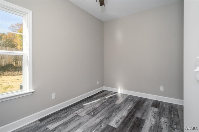 spare room featuring dark hardwood / wood-style flooring