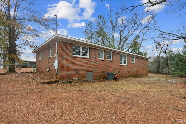 view of home's exterior with central AC