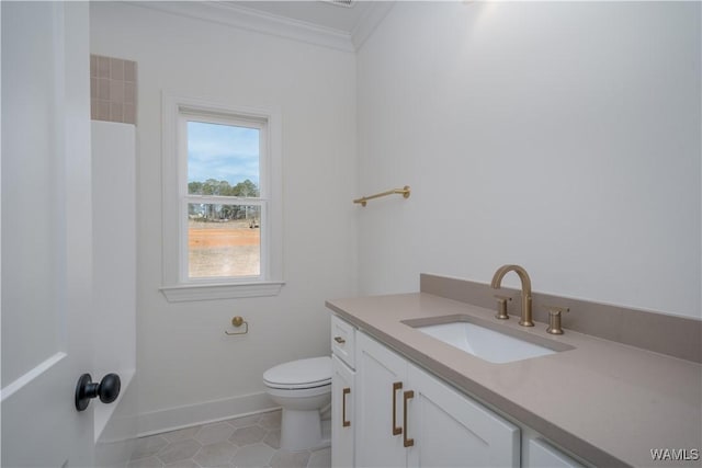 bathroom with crown molding, tile patterned floors, vanity, and toilet