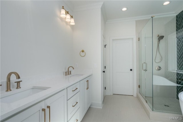 bathroom featuring ornamental molding, separate shower and tub, and vanity