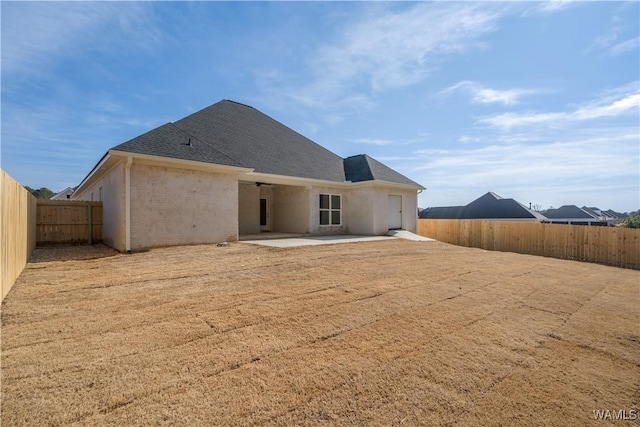 back of property with a patio