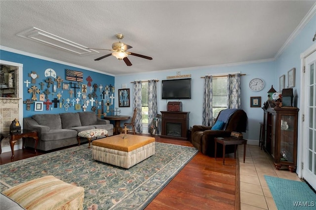 12569 Covered Bridge Rd, Brookwood, AL 35444 - living area with a ceiling fan, crown molding, attic access, plenty of natural light, and wood finished floors