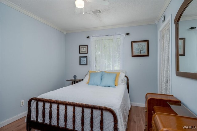 12569 Covered Bridge Rd, Brookwood, AL 35444 - bedroom featuring crown molding, wood finished floors, arched walkways, and ceiling fan