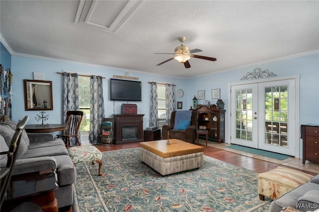 12569 Covered Bridge Rd, Brookwood, AL 35444 - living room featuring ceiling fan, a textured ceiling, french doors, ornamental molding, and wood finished floors