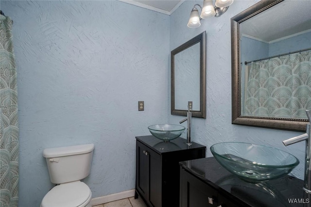 12569 Covered Bridge Rd, Brookwood, AL 35444 - bathroom featuring crown molding, two vanities, and tile patterned floors