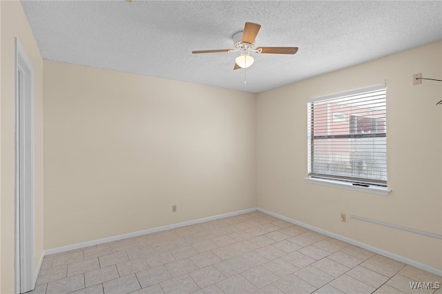 1500 W Beach Blvd Unit 212, Gulf Shores, AL 36542 - unfurnished room featuring baseboards, a textured ceiling, ceiling fan, and light tile patterned flooring