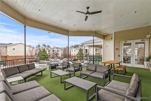 exterior space with french doors, outdoor lounge area, and a residential view