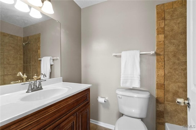 full bath featuring vanity, a shower, and toilet